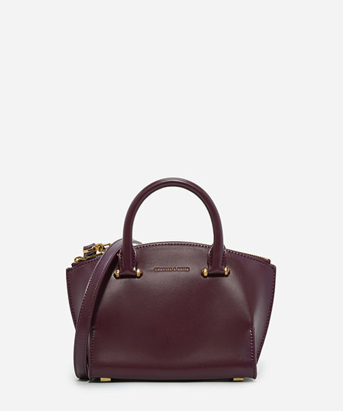 CHARLES & KEITH(チャールズ & キース)の「カーブジップハンドバッグ / CURVED ZIP HANDBAG(ハンドバッグ・レディース・プラム/レンガ/ブラック・S)」の3枚目の写真