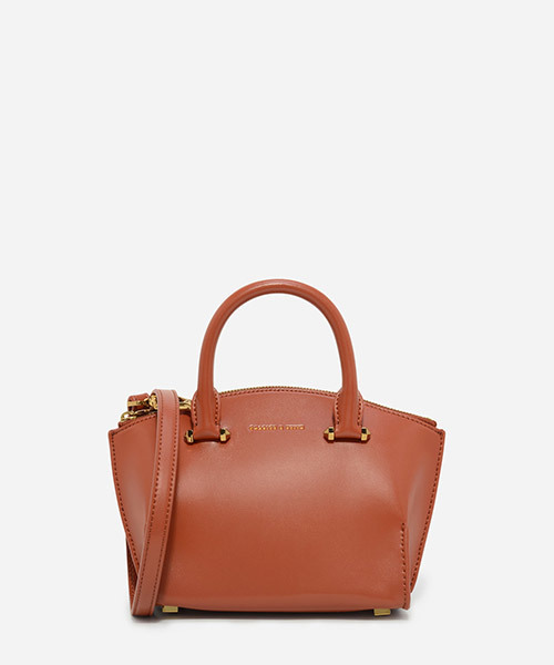 CHARLES & KEITH(チャールズ & キース)の「カーブジップハンドバッグ / CURVED ZIP HANDBAG(ハンドバッグ・レディース・プラム/レンガ/ブラック・S)」の1枚目の写真