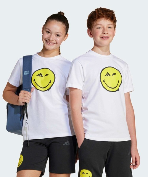 adidas(アディダス)の「adidas × Smileyworld グラフィック 半袖Tシャツ キッズ / アディダス adidas(Tシャツ/カットソー・キッズ・ホワイト/ブラック・130/140/150/160)」の2枚目の写真