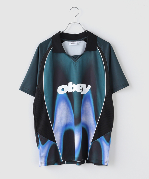 OBEY(オベイ)の「OBEY / オベイ BLURRED SOCCER JERSEY(Tシャツ/カットソー・メンズ・レッド/ブルー・LARGE/MEDIUM)」の1枚目の写真