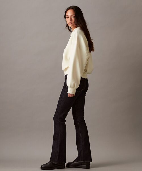 Calvin Klein（カルバン・クライン）の「スキッパーネック リラックスド プルオーバー（ポロシャツ・レディース・アイボリー・XS/S/M）」の3枚目の写真