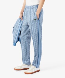 LACOSTE（ラコステ）の「サイドテーピングモノグラムジャカードトラックパンツ（スウェットパンツ）」