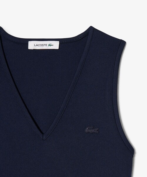 LACOSTE(ラコステ)の「スリーブレスプリーツロングドレス(ワンピース・レディース・オフホワイト/ネイビー・38/40/36)」の9枚目の写真