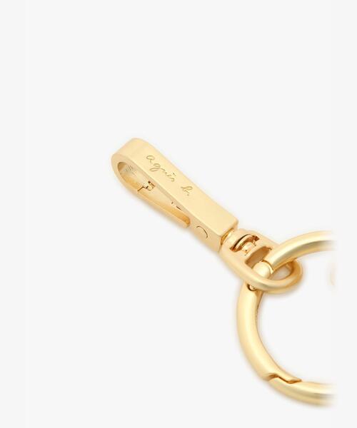 agnes b.（アニエスベー）の「ロゴ メタル カーディガンプレッション チャーム ABA01－01（キーホルダー・レディース・ブラック・FREE）」の3枚目の写真