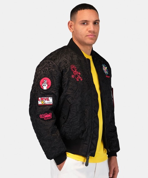 Alpha Industries（アルファインダストリーズ）の「Alpha Industries/アルファインダストリーズ/Keith Haring X Alpha MA-1 ALL OVER EMBROIDERY/キース へリング エムエーワン オール オーバー エンブロイダリー（MA-1・メンズ・ブラック・SMALL/MEDIUM/LARGE/X-LARGE）」の9枚目の写真