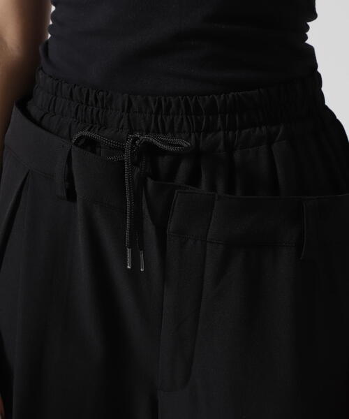 AULA AILA（アウラアイラ）の「AULA AILA/アウラアイラ/別注アシンメトリーカラーパンツ（その他パンツ・レディース・グレー/ブラック・0）」の9枚目の写真