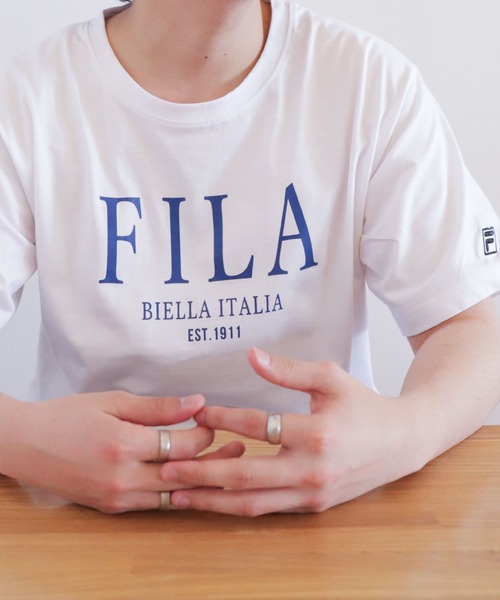 FILA(フィラ)の「【FILA】 ロゴ プリント / 刺繍 レギュラーシルエット ハーフスリーブ 綿100 Tシャツ(Tシャツ/カットソー・レディース・ネイビー系3/サックスブルー系1/ホワイト系5/ブラック系1/グレー系/カーキ系/カーキ系2/ライトグリーン系1/オフホワイト/ライトグリーン/ホワイト×ブルー/ブラック×ホワイト/ホワイト系2/サックスブルー系/ホワイト系4/ブラック系3/グレー系2/ライトグリーン系/ピンク/ホワイト×レッド/ホワイト系1/ネイビー系2/ネイビー系4/ピンク系/ブラック系/ブラック系2/グレー系1/カーキ系1/カーキ系3/ネイビー系/サックスブルー/ブルーグレー/ホワイト×ブラック/ホワイト系/ホワイト系3/ネイビー系1/ホワイト系その他/ホワイト系その他3/ホワイト系6/ブラック系4/カーキ系4/ホワイト系その他4/ホワイト×ネイビー/ピンク系1/ホワイト系7/ホワイト系8/ホワイト系9/サックスブルー系2/ピンク系2/サックスブルー系3/ピンク系3/ネイビー系5/ホワイト系その他5/ホワイト系その他6/ブラック系5/ブラック系6/ネイビー系6/ホワイト系その他2/Off White/ネイビー系7/グレー系3/ブラック系7/ホワイト系その他7・X-LARGE/LARGE/MEDIUM)」の10枚目の写真
