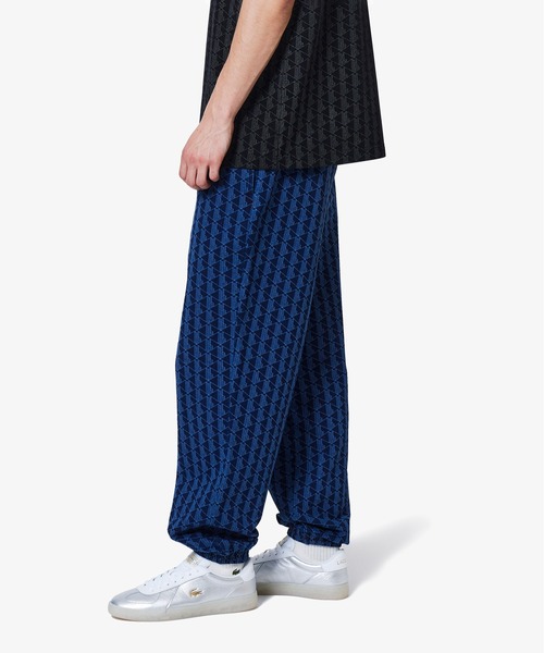 LACOSTE（ラコステ）の「インディゴスウェットモノグラムトラックパンツ（スウェットパンツ・メンズ・ライトインディゴブルー/インディゴブルー・38/46/42）」の2枚目の写真