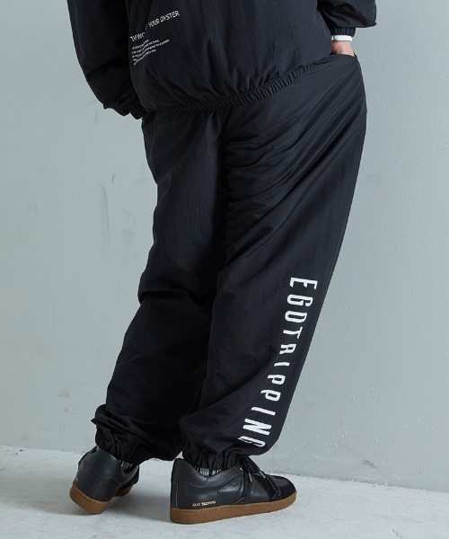EGO TRIPPING(エゴトリッピング)の「mp15256-DAYGLYDE TRACK PANTS トラックパンツ(626755)(その他パンツ・メンズ・ブラック/ダークブラウン・M/L)」の1枚目の写真