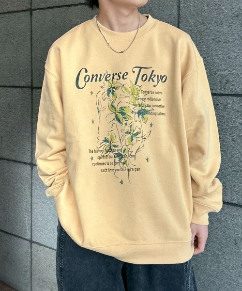 CONVERSE TOKYO(コンバーストウキョウ)の「LILY FLOWER PRINT SWEAT(スウェット・レディース・イエロー/スミクロ/アイボリー・MEDIUM/SMALL)」の1枚目の写真