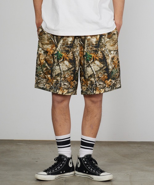 Champion(チャンピオン)の「Champion/チャンピオン リアルツリー柄 ワッペンロゴ リップストップ イージーショーツ 2026年春夏(その他パンツ・メンズ・ブラック/カモフラージュ・M/L/XL)」の1枚目の写真