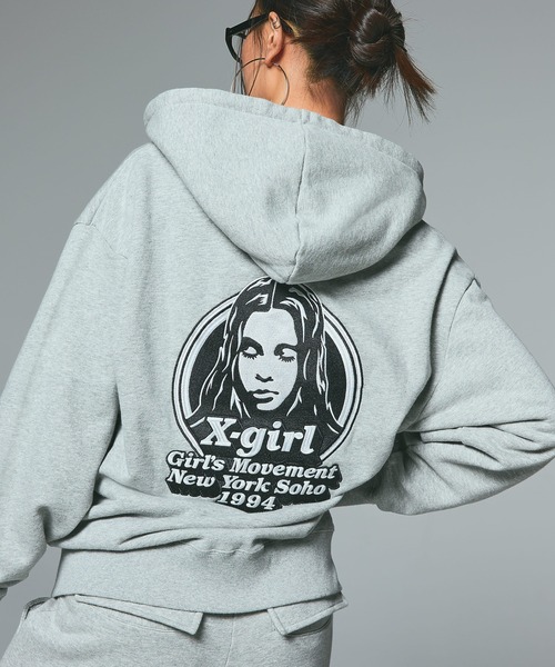 X-girl（エックスガール）の「MESSAGE AND FACE ZIP UP SWEAT