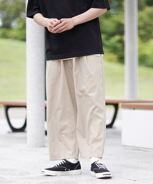 anown(アノン)の「ワイドシルエット イージーツイルチノパンツ【ファッションインフルエンサー つぐ吉×anown 限定コラボ】(スラックス・メンズ・ダークグリーン/ベージュ・M/L)」の1枚目の写真