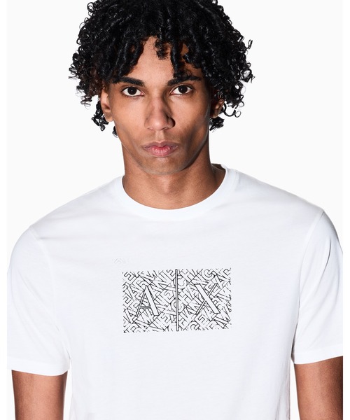ARMANI EXCHANGE(アルマーニエクスチェンジ)の「【A|X アルマーニ エクスチェンジ】ダイアゴナルオールオーバーロゴ ボックスプリント 半袖クルーネックTシャツ/SLIM(Tシャツ/カットソー・メンズ・ブラック/オフホワイト・MEDIUM/LARGE/X-LARGE/SMALL/X-SMALL/XX-LARGE)」の1枚目の写真
