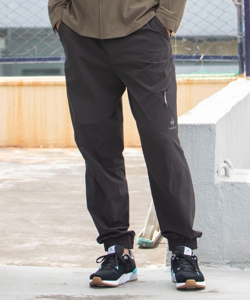 le coq sportif(ルコックスポルティフ)の「【サイクリング】エアスタイリッシュCORDURAサイクリングパンツ【Glambike】 ロングパンツ ボトムス サイクリングウェア スポーツウェア(その他パンツ・メンズ・ブロンズ/ブラック/ネイビー・M/L/XL)」の1枚目の写真