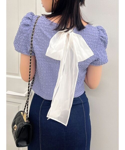 dazzlin(ダズリン)の「バックリボンシャーリングカットプルオーバー(Tシャツ/カットソー・レディース・パープル/オフホワイト/ブラック・FREE)」の1枚目の写真