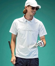 LUXEAKMPLUS（リュクスエイケイエムプラス）の「LUXEAKMPLUS(リュクスエイケイエムプラス)ゴルフ ラインストーンロゴ半袖ポロシャツ（ポロシャツ）」