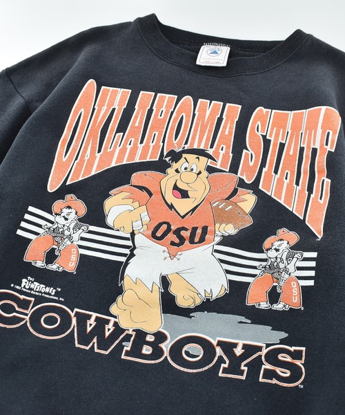 VINTAGE(ヴィンテージ)の「【USED】90's DELTA “OKLAHOMA STATE COWBOYS × THE FLINTSTONE” スウェット(スウェット・メンズ・ブラック・X-LARGE)」の2枚目の写真