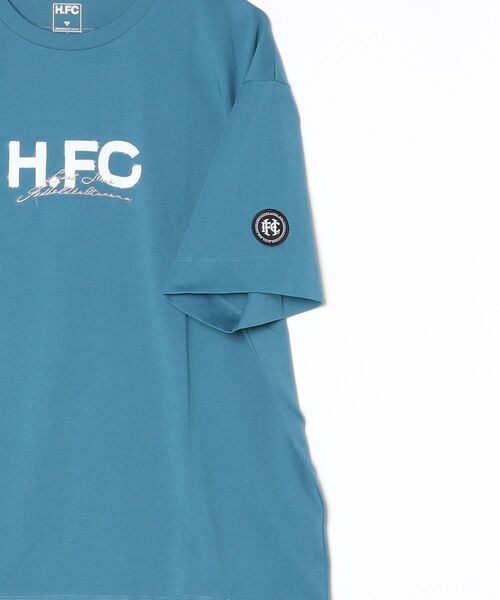 hummel（ヒュンメル）の「hummel/ヒュンメル H.FC ﾛｺﾞTｼｬﾂ（Tシャツ/カットソー・レディース・ブルー/ブラック/ホワイト・L/XL/M）」の12枚目の写真