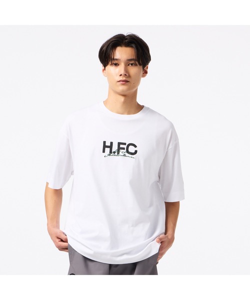 hummel（ヒュンメル）の「hummel/ヒュンメル H.FC ﾛｺﾞTｼｬﾂ（Tシャツ/カットソー・レディース・ブルー/ブラック/ホワイト・L/XL/M）」の2枚目の写真