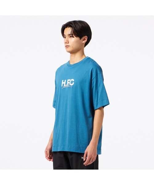 hummel（ヒュンメル）の「hummel/ヒュンメル H.FC ﾛｺﾞTｼｬﾂ（Tシャツ/カットソー・レディース・ブルー/ブラック/ホワイト・L/XL/M）」の6枚目の写真
