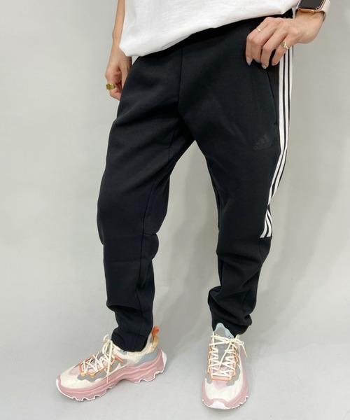 adidas（アディダス）の「adidas/アディダス  ルーズシルエット  スリーストライプスジャージパンツ   49220（その他パンツ・レディース・ブラック×ホワイト/ブラック・L/S/M）」の2枚目の写真