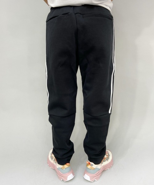 adidas（アディダス）の「adidas/アディダス  ルーズシルエット  スリーストライプスジャージパンツ   49220（その他パンツ・レディース・ブラック×ホワイト/ブラック・L/S/M）」の6枚目の写真