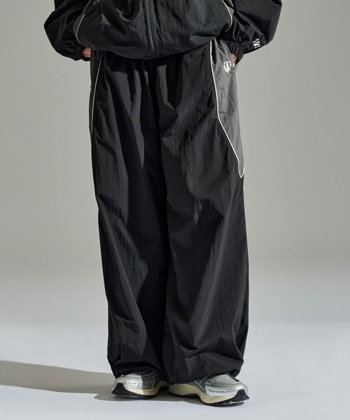 WETTEMPT（ウィテンプト）の「UMBRO WIDE NYLON PANTS / アンブロワイドナイロンパンツ（その他パンツ・メンズ・ブラック/ネイビー・MEDIUM/LARGE）」の6枚目の写真