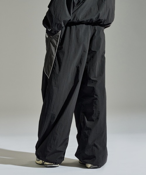 WETTEMPT（ウィテンプト）の「UMBRO WIDE NYLON PANTS / アンブロワイドナイロンパンツ（その他パンツ・メンズ・ブラック/ネイビー・MEDIUM/LARGE）」の10枚目の写真