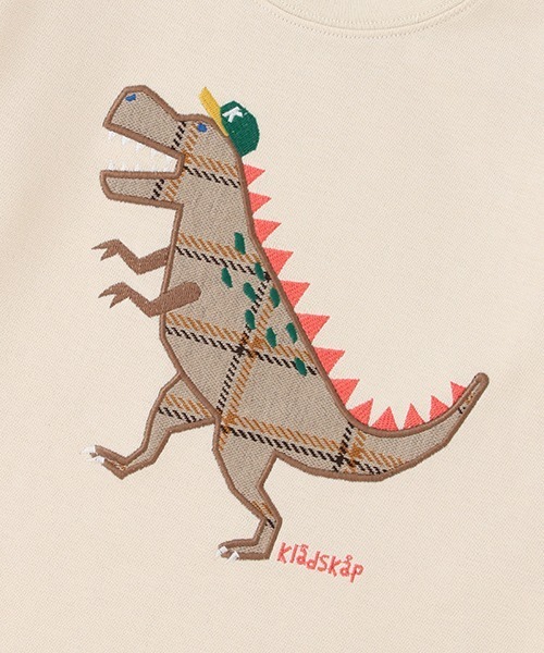 kladskap（クレードスコープ）の「恐竜アップリケ袖チェック切替  