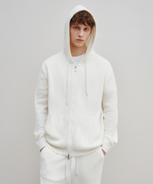 J'RIUM（ジェイリウム）の「アジオライトニットフードパーカーアイボリー（パーカー）」