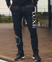 LUXEAKMPLUS(リュクスエイケイエムプラス)サークルロゴウィンドパンツ