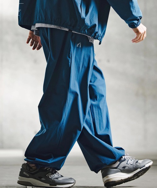 GLIMCLAP(グリムクラップ)の「mp15195-Ripstop & Stretch Nylon Wide Track Pants トラックパンツ(211-005-gla-cg)(その他パンツ・メンズ・ブラック/ブルー・S/L/M)」の1枚目の写真
