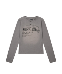 AAKAM（アーカム）の「Button Lettering Long Sleeve (Brown)（Tシャツ/カットソー）」