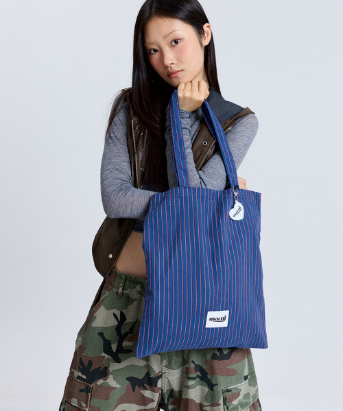 MACNI(マクニ)の「HEART STRIPE ECO BAG BLUE(エコバッグ/サブバッグ・レディース・その他・FREE)」の1枚目の写真