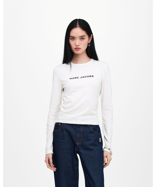 MARC JACOBS(マークジェイコブス)の「OVERSIZED RUNWAY BOW LOGO LONGSLEEVE/オーバーサイズド ランウェイ ボウ ロゴ ロングスリーブ(Tシャツ/カットソー・レディース・ホワイト・L/M/S/XS)」の1枚目の写真