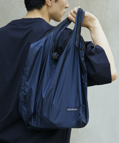 THOUSAND MILE（サウザンドマイル）の「THOUSAND MILE 別注セットアップ上下+トートバッグ 3点セット（Tシャツ/カットソー・メンズ・ブラック/ネイビー・MEDIUM/LARGE）」の10枚目の写真