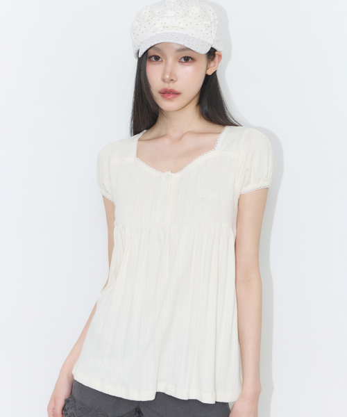 ILLIGO(イリゴ)の「フレアシャーリングトップクリーム(Tシャツ/カットソー・レディース・その他・OS)」の1枚目の写真
