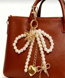 VIBGYOR（ヴィブジョー）の「【IZU】 ゴールドパールリボン＆スターフィッシュバッグチャーム（チャーム）」