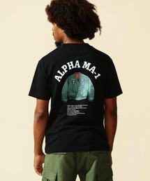 ALPHA（アルファ）の「USグラフィック プリントＴシャツ 半袖 (FLIGHT JAKET)（Tシャツ/カットソー・メンズ）」