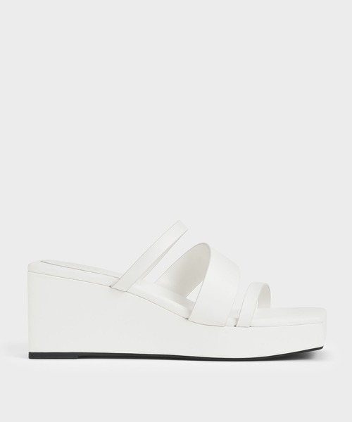 CHARLES & KEITH(チャールズ & キース)の「アシンメトリック プラットフォームウェッジ / Asymmetric Platform Wedges(サンダル・レディース・ホワイト/ブラック/ライトベージュ・22.5cm/23cm/23.5cm/24.5cm/25cm/25.5cm)」の1枚目の写真
