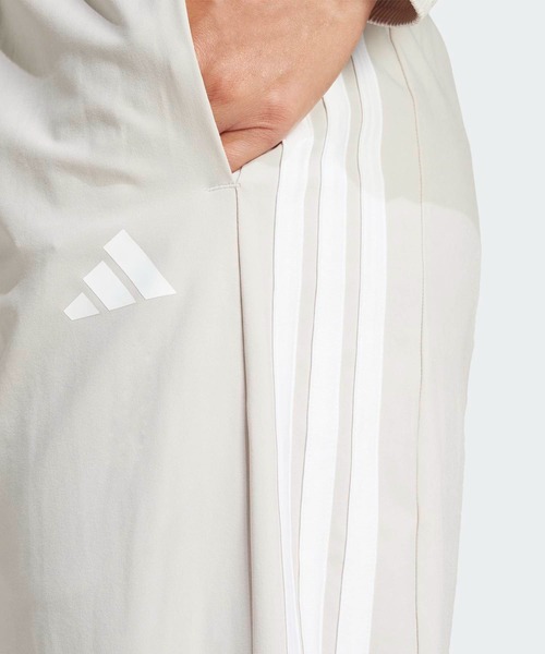 トレイン エッセンシャルズ スリーストライプス ウーブンパンツ