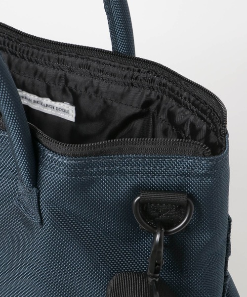 SML(エスエムエル)の「『別注』S.M.L×DOORS S.M.Lヘルメットバッグ(バックパック/リュック・メンズ・ブラック/ネイビー・ONE)」の9枚目の写真