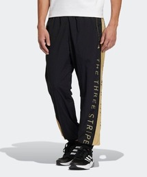 adidas（アディダス）の「adidas/アディダスワーディング ウーブンパンツ（ジェンダーニュートラル） UB119（その他パンツ・メンズ）」