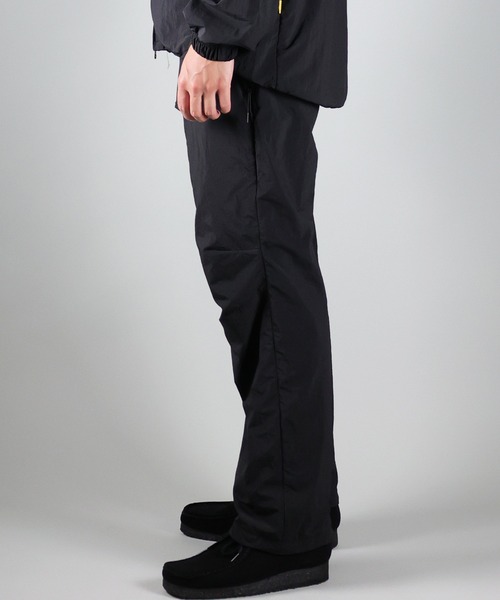 NUMBER (N)INE(ナンバーナイン)の「NUMBER (N)INE/ナンバーナイン TRACK PANTS/ベンチレーション シリコンプリント ナイロントラックパンツ/メッシュ裏地(その他パンツ・メンズ・ブラック/オリーブ/ベージュ・2/4/3)」の8枚目の写真