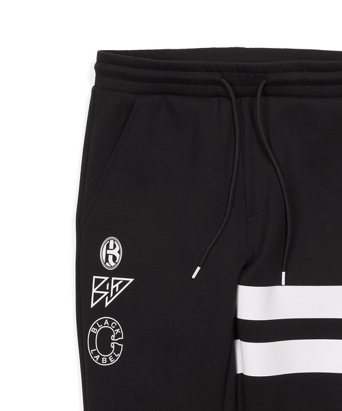 The DUFFER of ST.GEORGE（ザダファーオブセントジョージ）の「〔BLACK LABEL〕"SORONA" ATHLETIC SLIM PANTS：セットアップ ダンボールニット スリムパンツ（スウェットパンツ・メンズ・ブラック/ブラック系その他/グレイッシュベージュ・SMALL/MEDIUM/LARGE/X-LARGE）」の19枚目の写真