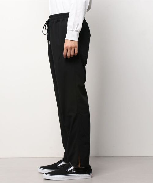 NUMBER (N)INE(ナンバーナイン)の「STRAIGHT-LEG SLIT DRAWSTRING TROUSERS / ストレートライン サイドスリット ウエストコード ゴムシャーリング スラックスパンツ(スラックス・メンズ・グレー/ブラック×グレー/ブラック・3/2/4)」の19枚目の写真