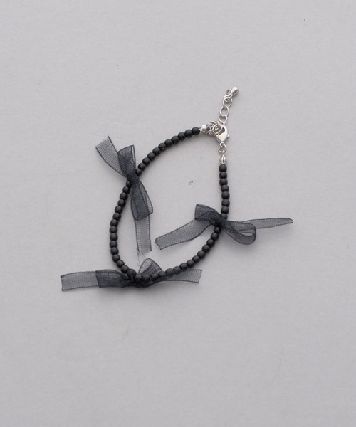 one after another NICE CLAUP（ワンアフターアナザーナイスクラップ）の「【ribbon collection】オーガンリボンブレスレット（ブレスレット・レディース・アイボリー/ブラック・FREE）」の2枚目の写真
