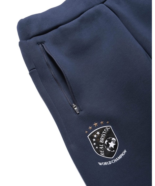 F.C.Real Bristol（エフシーレアルブリストル）の「CHAMPIONS BONDING SWEAT PANTS（スウェットパンツ・メンズ・ネイビー/ブラック/グレー・SMALL/MEDIUM/LARGE/X-LARGE/XX-LARGE）」の19枚目の写真