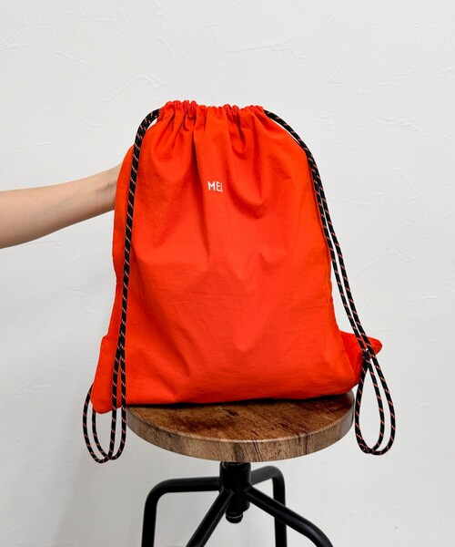 MEI ALP. リュック・バックパック オレンジ/グレー　新品 MEI（メイ）の「【MEI/メイ】ショルダー付ナップサック（バック